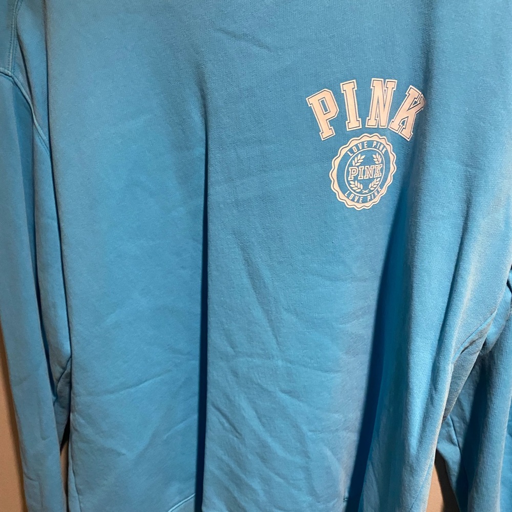 A blue sweat shirt
